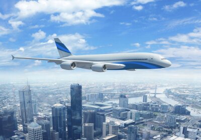 Obraz Biały samolot pasażerski nad miastem