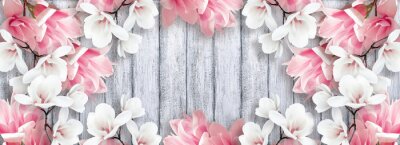 Obraz Kwiaty magnolii na drewnianych deskach