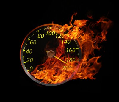 Obraz Prędkościomierz w ogniu na czarnym tle